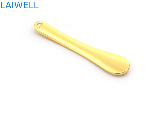 El metal de encargo a presión cuchara plateada oro del maquillaje de la crema de cara de la aleación del cinc de la fundición que sella la aguafuerte