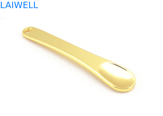 El metal de encargo a presión cuchara plateada oro del maquillaje de la crema de cara de la aleación del cinc de la fundición que sella la aguafuerte