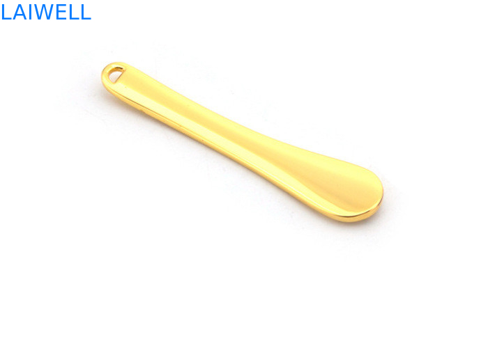 El metal de encargo a presión cuchara plateada oro del maquillaje de la crema de cara de la aleación del cinc de la fundición que sella la aguafuerte